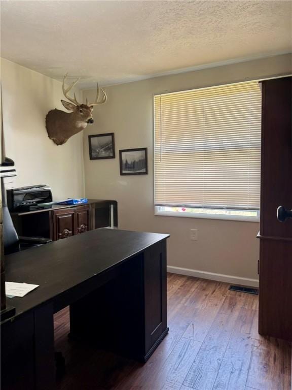 1060 Sugar Run Rd, Nottingham, PA 15367 - office with hardwood / wood-style flooring, baseboards, and a textured ceiling