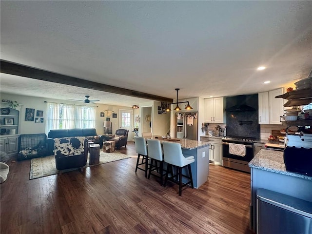 1060 Sugar Run Rd, Nottingham, PA 15367 - kitchen featuring gas stove, extractor fan, open floor plan, white cabinets, and decorative backsplash