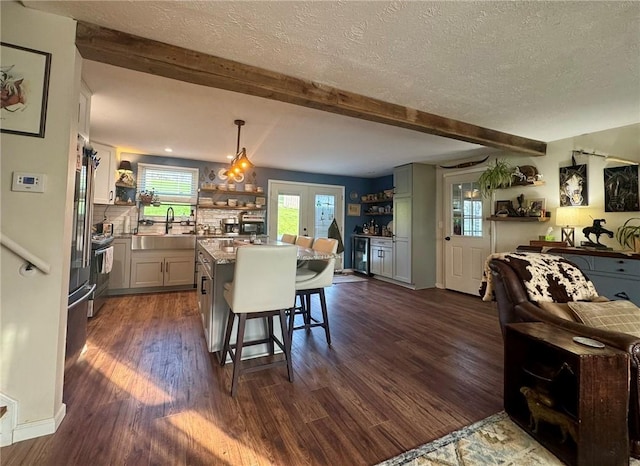 1060 Sugar Run Rd, Nottingham, PA 15367 - dining room featuring dark wood-style flooring, beam ceiling, and a textured ceiling