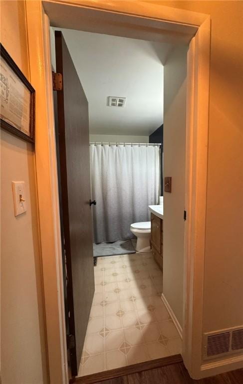 1060 Sugar Run Rd, Nottingham, PA 15367 - bathroom featuring tile patterned floors, vanity, toilet, and a shower with shower curtain