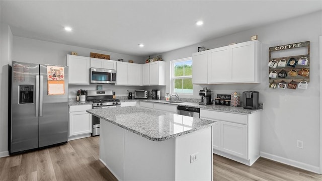 420 Fosse Ct, Harmony Boro But, PA 16037 - kitchen with appliances with stainless steel finishes, a sink, light wood-style floors, white cabinets, and recessed lighting