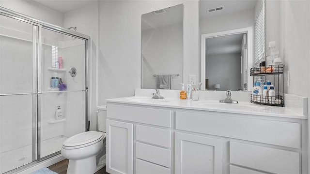 420 Fosse Ct, Harmony Boro But, PA 16037 - bathroom featuring toilet, a stall shower, and double vanity