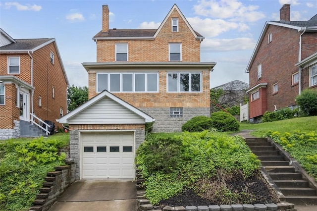 191 Clearview, West View, PA 15229 - view of front of home with brick siding, a garage, concrete driveway, and a chimney