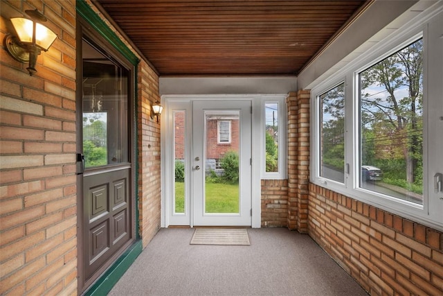 191 Clearview, West View, PA 15229 - unfurnished sunroom with wood ceiling, brick wall, and carpet flooring