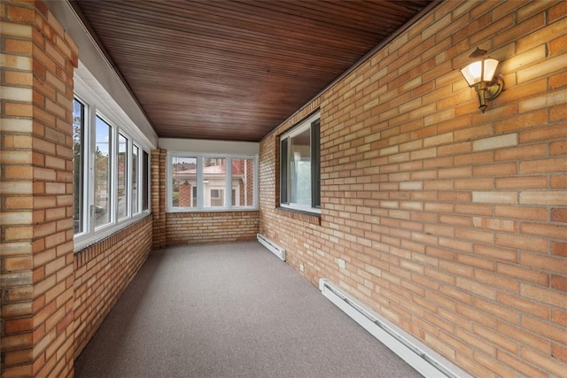 191 Clearview, West View, PA 15229 - unfurnished sunroom with a baseboard heating unit, baseboard heating, brick wall, carpet, and wood ceiling
