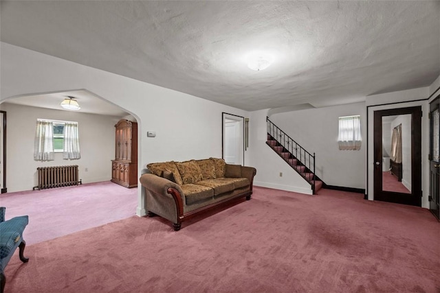 191 Clearview, West View, PA 15229 - living room featuring radiator heating unit, arched walkways, carpet, stairs, and a textured ceiling