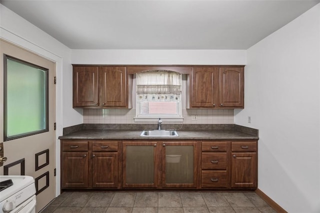 191 Clearview, West View, PA 15229 - kitchen featuring a sink, dark countertops, tasteful backsplash, and baseboards