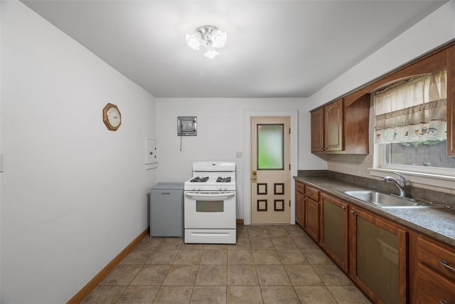 191 Clearview, West View, PA 15229 - kitchen with white range with gas stovetop, a sink, baseboards, dark countertops, and light tile patterned flooring