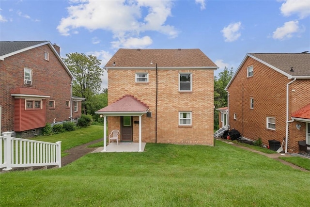 191 Clearview, West View, PA 15229 - back of property featuring brick siding, a patio, and a lawn