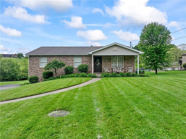 763 Chapel Rd, Center Twp Bea, PA 15001 - ranch-style house featuring brick siding, a front lawn, covered porch, and a shingled roof
