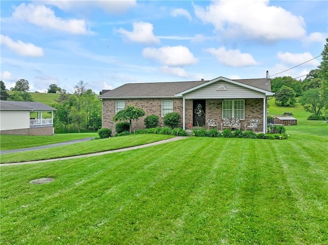 763 Chapel Rd, Center Twp Bea, PA 15001 - single story home with a porch, a front yard, and brick siding