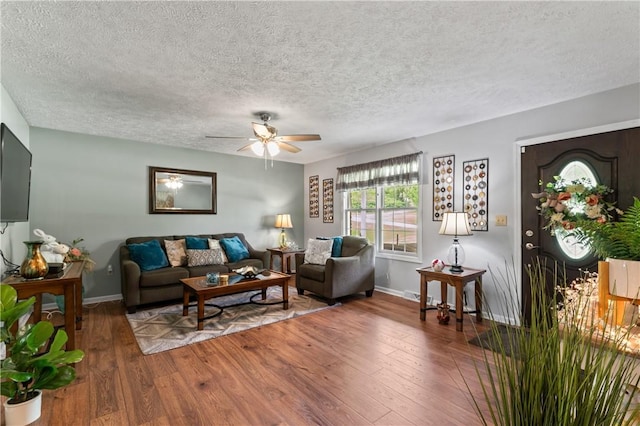 763 Chapel Rd, Center Twp Bea, PA 15001 - living area featuring wood finished floors, ceiling fan, baseboards, and a textured ceiling