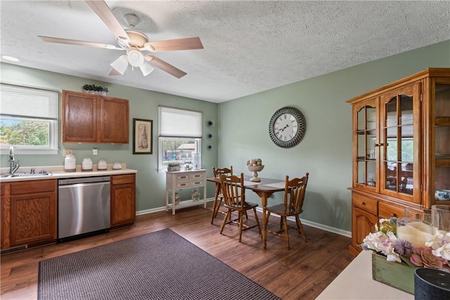 763 Chapel Rd, Center Twp Bea, PA 15001 - kitchen with stainless steel dishwasher, a sink, a textured ceiling, brown cabinets, and light countertops