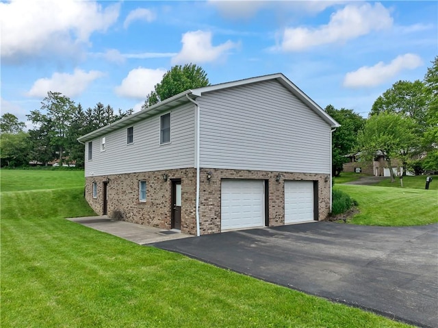 763 Chapel Rd, Center Twp Bea, PA 15001 - view of property exterior with brick siding, asphalt driveway, an attached garage, and a lawn