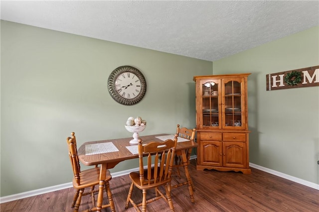 763 Chapel Rd, Center Twp Bea, PA 15001 - dining room featuring dark wood-style floors, a textured ceiling, and baseboards