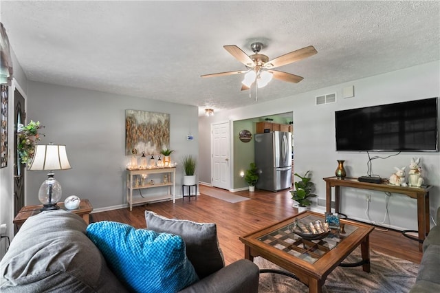 763 Chapel Rd, Center Twp Bea, PA 15001 - living area featuring ceiling fan, baseboards, wood finished floors, and a textured ceiling