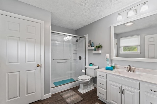 763 Chapel Rd, Center Twp Bea, PA 15001 - bathroom with a shower stall, vanity, toilet, wood finished floors, and a textured ceiling