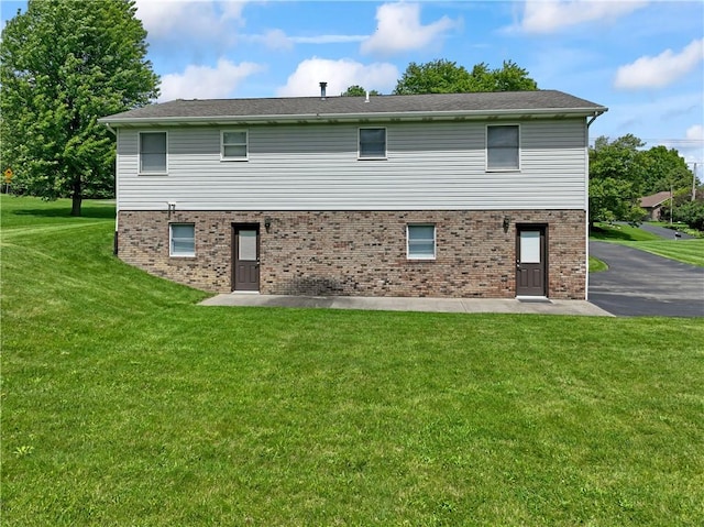 763 Chapel Rd, Center Twp Bea, PA 15001 - rear view of property with a lawn and brick siding