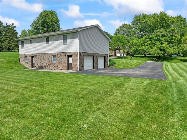 763 Chapel Rd, Center Twp Bea, PA 15001 - view of side of home with a garage, brick siding, driveway, and a yard