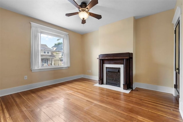 2938 Voelkel Ave, Dormont, PA 15216 - unfurnished living room with light wood-style flooring, a fireplace with flush hearth, ceiling fan, and baseboards