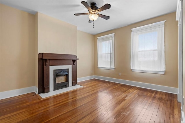 2938 Voelkel Ave, Dormont, PA 15216 - unfurnished living room featuring a ceiling fan, hardwood / wood-style floors, a fireplace with flush hearth, and baseboards