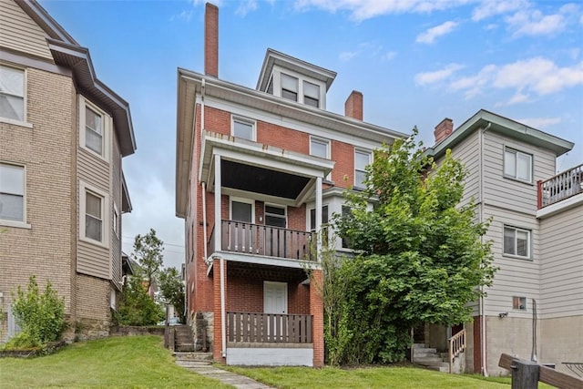 2938 Voelkel Ave, Dormont, PA 15216 - rear view of house with brick siding, a yard, and a balcony