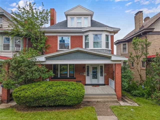 2938 Voelkel Ave, Dormont, PA 15216 - traditional style home with brick siding, a porch, and a chimney