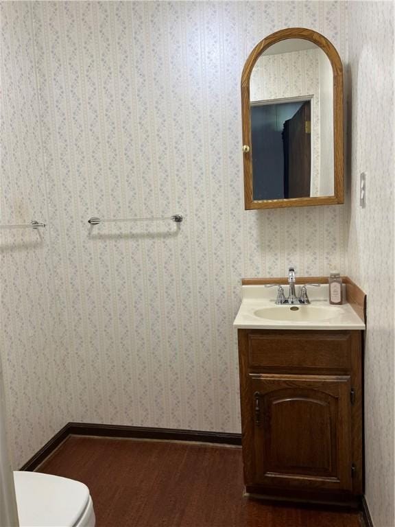 4130 James Dr, Lower Burrell, PA 15068 - bathroom with vanity, toilet, and wood finished floors