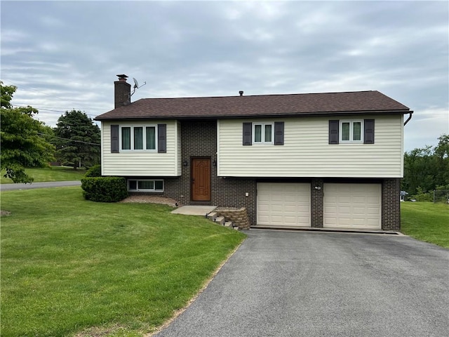 4130 James Dr, Lower Burrell, PA 15068 - bi-level home with an attached garage, a chimney, asphalt driveway, a front lawn, and brick siding