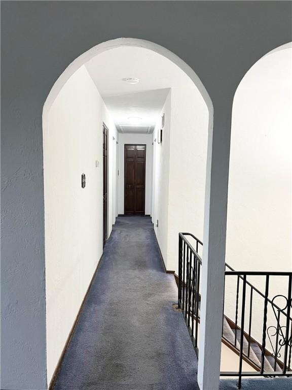 4130 James Dr, Lower Burrell, PA 15068 - hallway featuring an upstairs landing and arched walkways