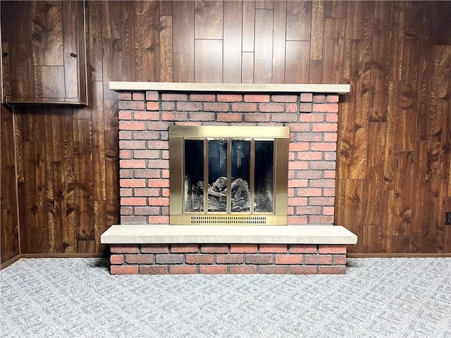 4130 James Dr, Lower Burrell, PA 15068 - detailed view of carpet floors, wood walls, a fireplace, and baseboards