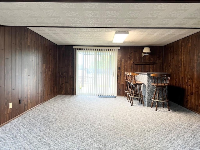 4130 James Dr, Lower Burrell, PA 15068 - indoor dry bar with wooden walls and carpet flooring