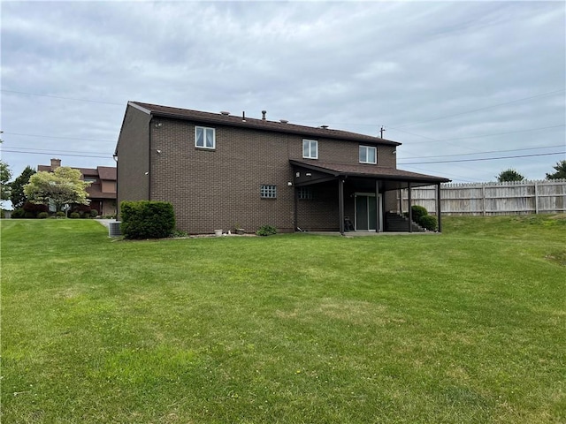 4130 James Dr, Lower Burrell, PA 15068 - back of house with central AC unit and brick siding
