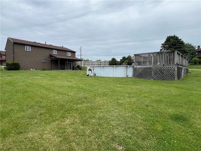 4130 James Dr, Lower Burrell, PA 15068 - view of grassy yard with a deck