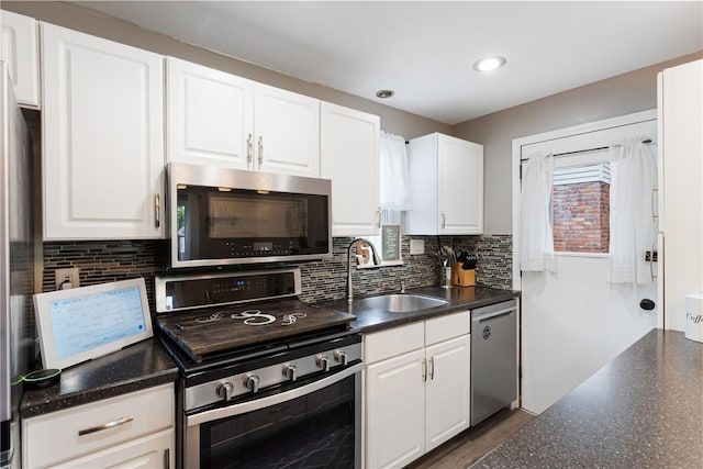 5268 Fieldcrest Dr, Whitehall, PA 15236 - kitchen featuring stainless steel appliances, a sink, backsplash, white cabinetry, and recessed lighting