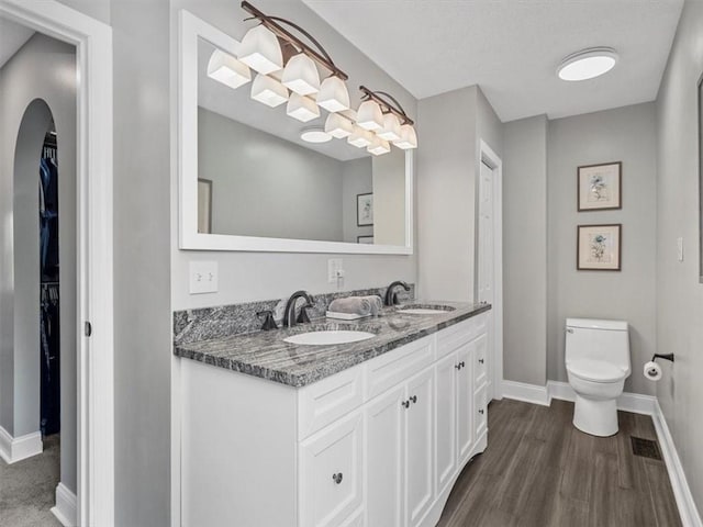 13 Westchester Ct, Robinson Twp Nwa, PA 15136 - full bath featuring double vanity, toilet, baseboards, and wood finished floors