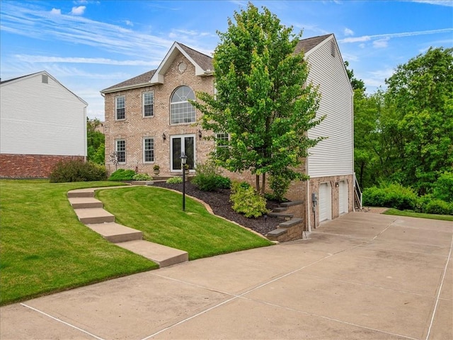 13 Westchester Ct, Robinson Twp Nwa, PA 15136 - colonial home featuring a garage, brick siding, driveway, and a front yard