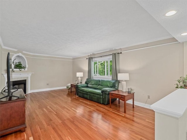 13 Westchester Ct, Robinson Twp Nwa, PA 15136 - living room featuring a textured ceiling, baseboards, light wood-style floors, a fireplace, and crown molding