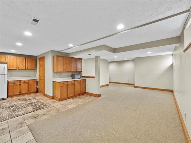 13 Westchester Ct, Robinson Twp Nwa, PA 15136 - kitchen featuring freestanding refrigerator, baseboards, recessed lighting, light countertops, and brown cabinets