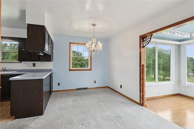 1509 Edmon Rd, Kiskiminetas Twp, PA 15618 - kitchen with healthy amount of natural light, light countertops, a chandelier, and a sink