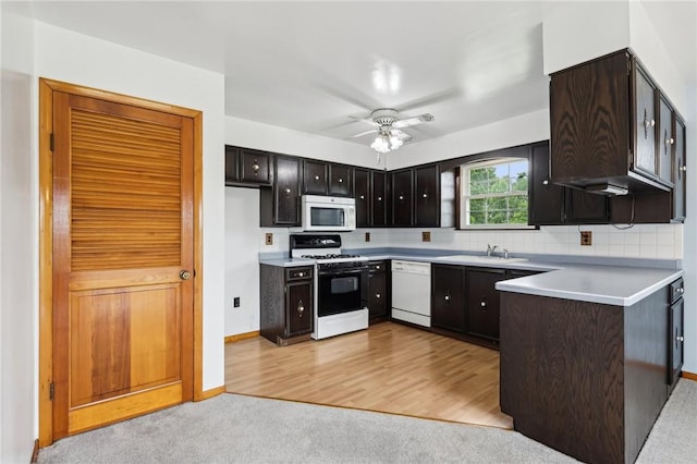 1509 Edmon Rd, Kiskiminetas Twp, PA 15618 - kitchen with white appliances, a sink, light countertops, a ceiling fan, and decorative backsplash