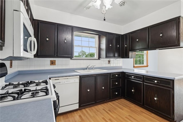 1509 Edmon Rd, Kiskiminetas Twp, PA 15618 - kitchen featuring white appliances, a sink, healthy amount of natural light, and tasteful backsplash