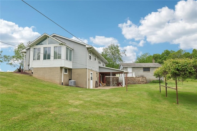 1509 Edmon Rd, Kiskiminetas Twp, PA 15618 - rear view of house featuring a lawn, a patio area, and central AC unit