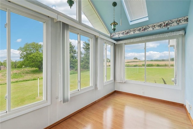 1509 Edmon Rd, Kiskiminetas Twp, PA 15618 - unfurnished sunroom with a skylight, wood finished floors, vaulted ceiling, and baseboards