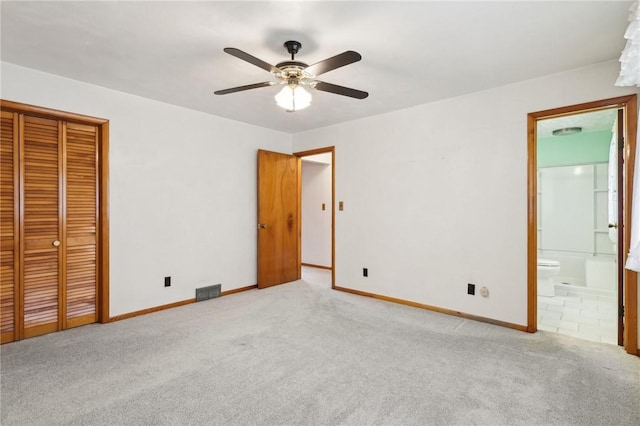 1509 Edmon Rd, Kiskiminetas Twp, PA 15618 - unfurnished bedroom with carpet flooring, baseboards, connected bathroom, a closet, and ceiling fan