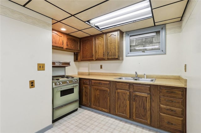 1509 Edmon Rd, Kiskiminetas Twp, PA 15618 - kitchen with a sink, range with gas cooktop, light countertops, and light flooring