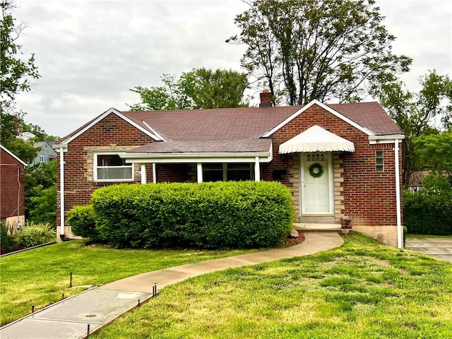 3329 Recker Dr, Baldwin Boro, PA 15227 - view of front facade featuring a front yard, brick siding, a chimney, and a shingled roof