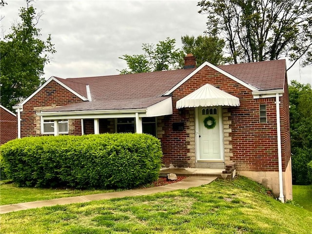 3329 Recker Dr, Baldwin Boro, PA 15227 - view of front facade with a chimney, brick siding, a front yard, and roof with shingles