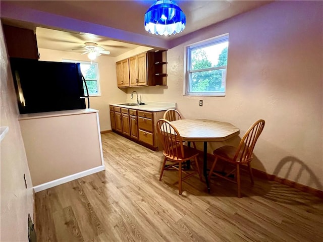 3329 Recker Dr, Baldwin Boro, PA 15227 - dining room with light wood finished floors, baseboards, and ceiling fan