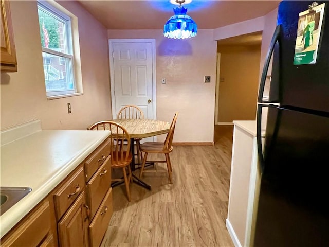 3329 Recker Dr, Baldwin Boro, PA 15227 - dining area with light wood-style flooring and baseboards